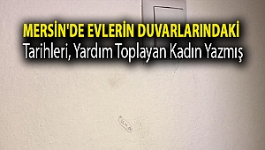 Mersin'de evlerin duvarlarındaki tarihleri, yardım toplayan kadın yazmış