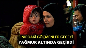 Sınırdaki göçmenler geceyi yağmur altında geçirdi