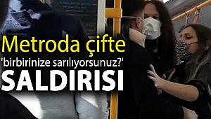 Metroda çifte 'birbirinize sarılıyorsunuz?' saldırısı
