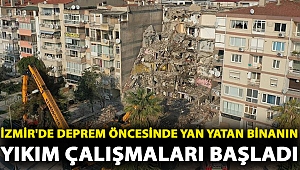 İzmir'de deprem öncesinde yan yatan binanın yıkım çalışmaları başladı